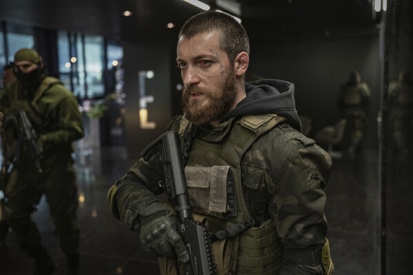 Movie Review Chris Hemsworth returns in Extraction 2 a gun for